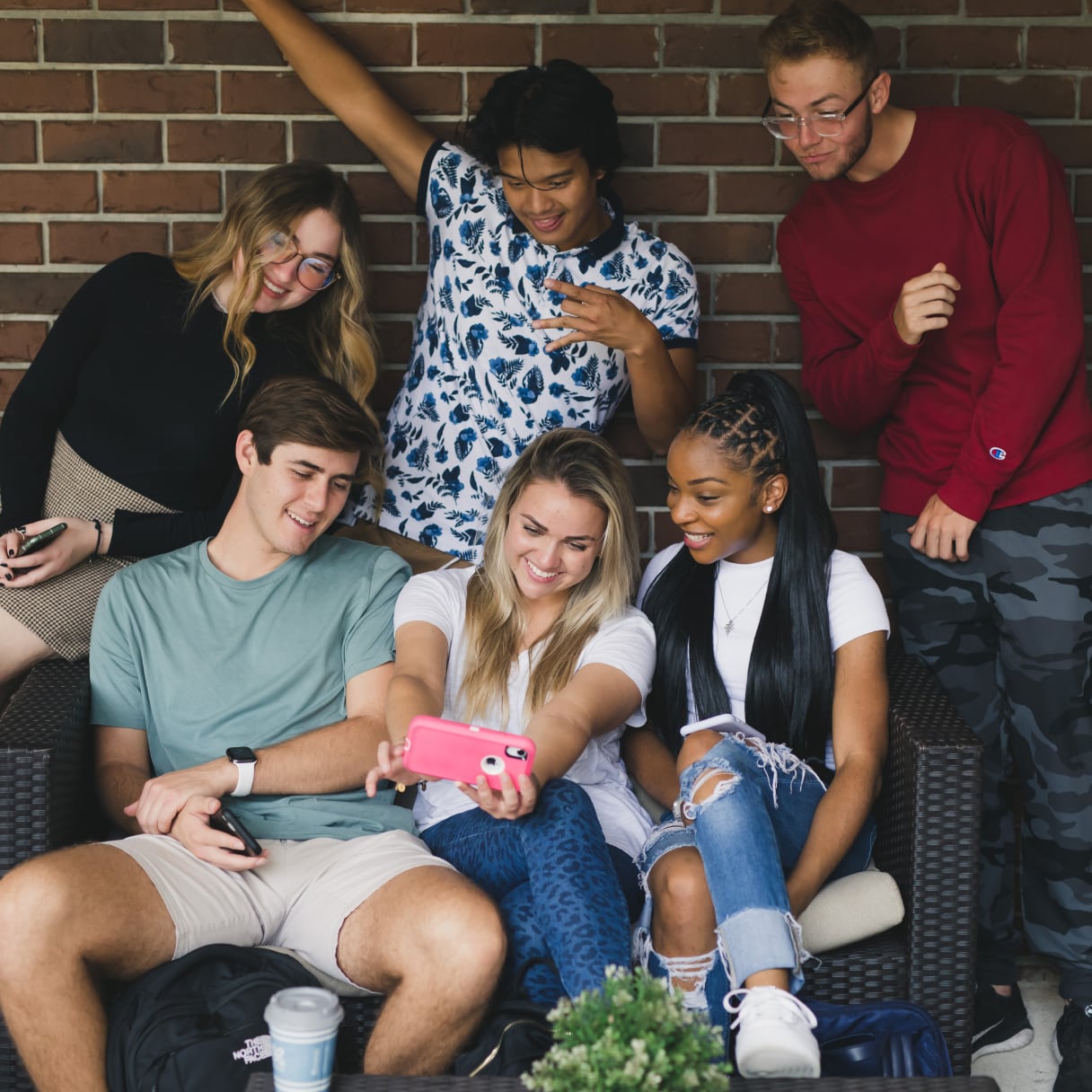 Group of friends take a selfie on the couch