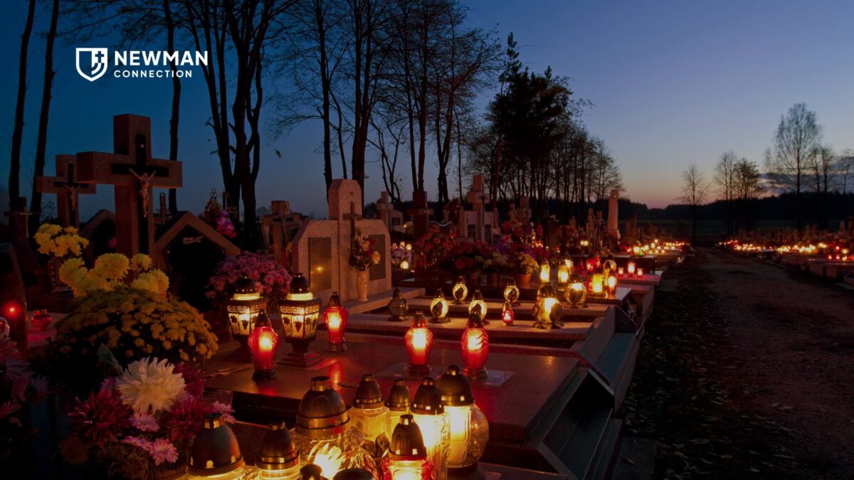 A photo of a cemetary at dusk, with candles lit on graves. The Newman Connection logo is in the top left corner.
